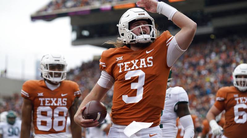 Texas quarterback Quinn Ewers (3) celebrates after scoring a touchdown against Baylor during...