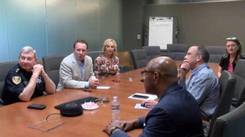 Louisiana Attorney General Jeff Landry (second from left) visits with officials Aug. 23, 2023,...